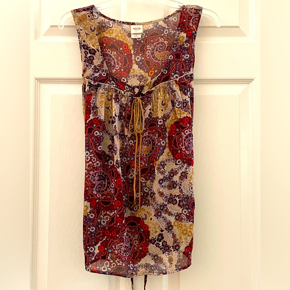 Large light flowy blouse.